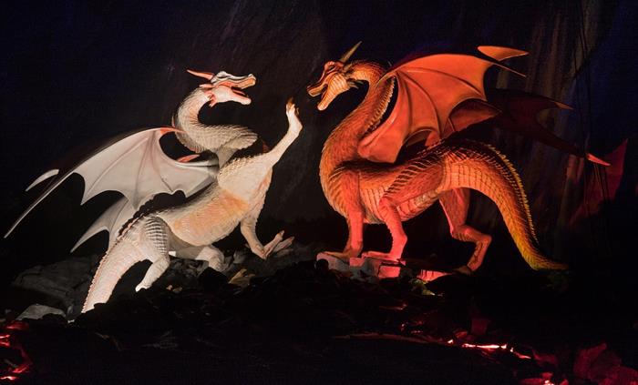 Red and white dragons fighting underground